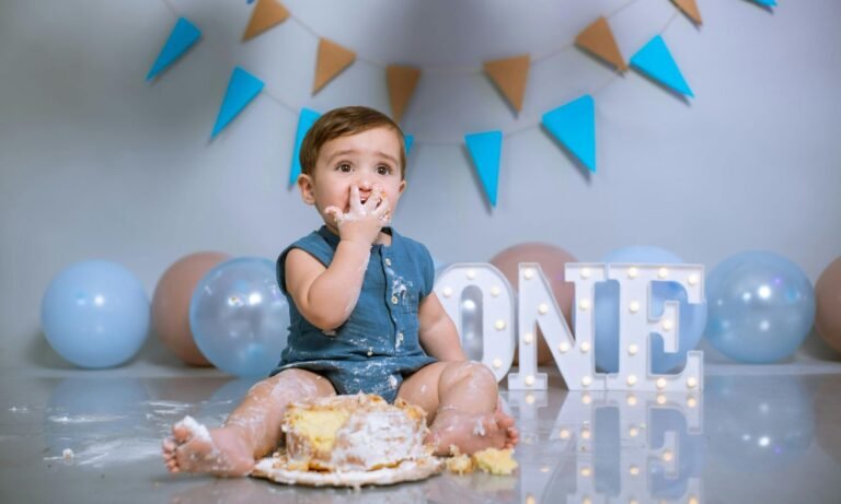 Baby having birthday cake
